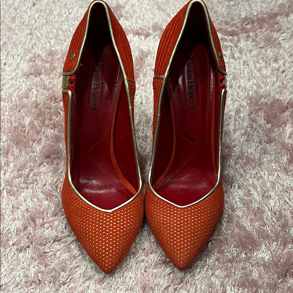 Elegant Red Cesare Paciotti Heels with Gold Trim.